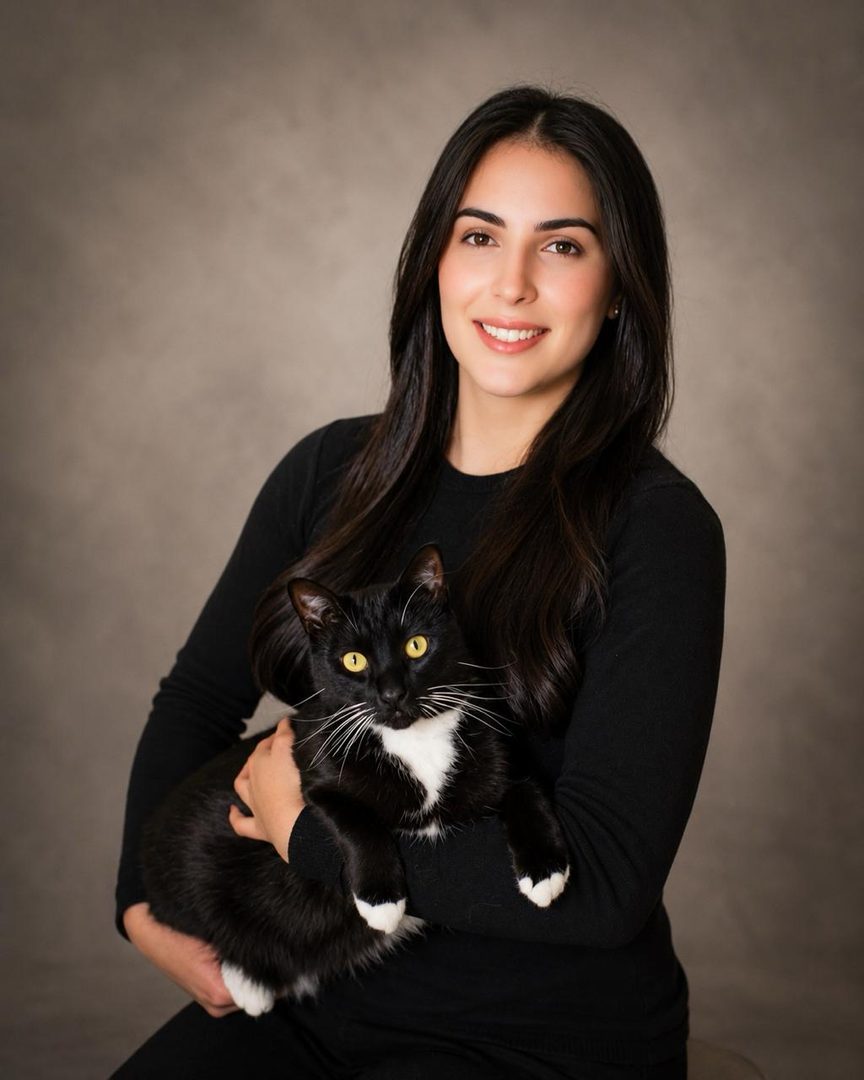 Ana, Regulatory at Alerte Digital Vet, photographed with their pet