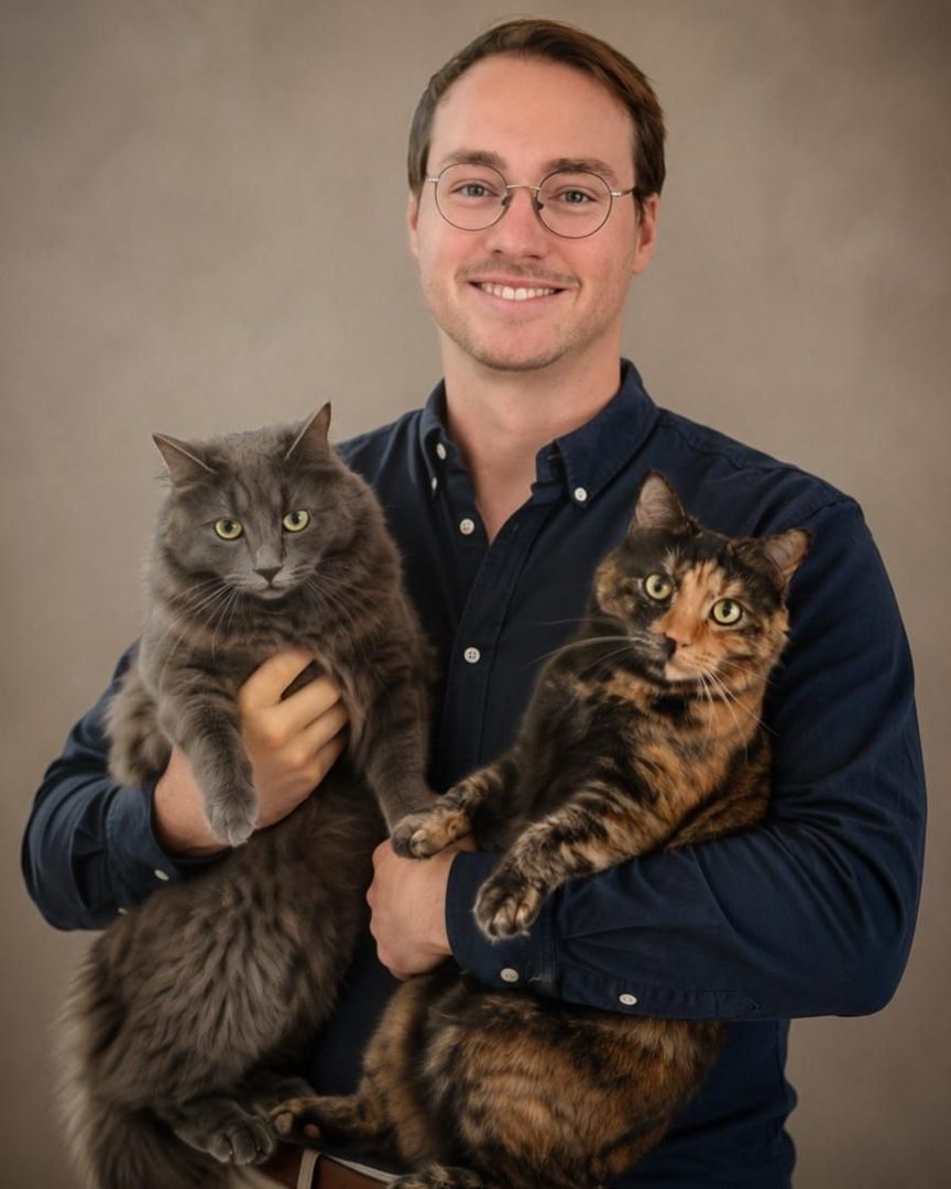 Luke Bollam, Co-founder at Alerte Digital Vet, photographed with their pet
